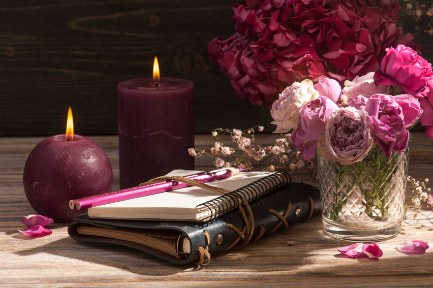 Journals and Pen with Candles and Flowers