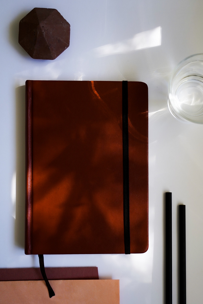 A Journal over a White Table
